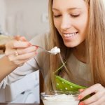 Girl eats cottage cheese