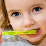Teach your child to brush his baby teeth