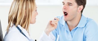 Doctor examining tongue